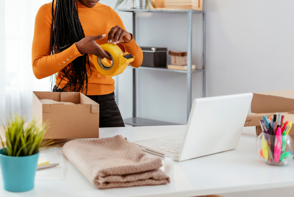 woman packing a box as one type of Christian mom business ideas