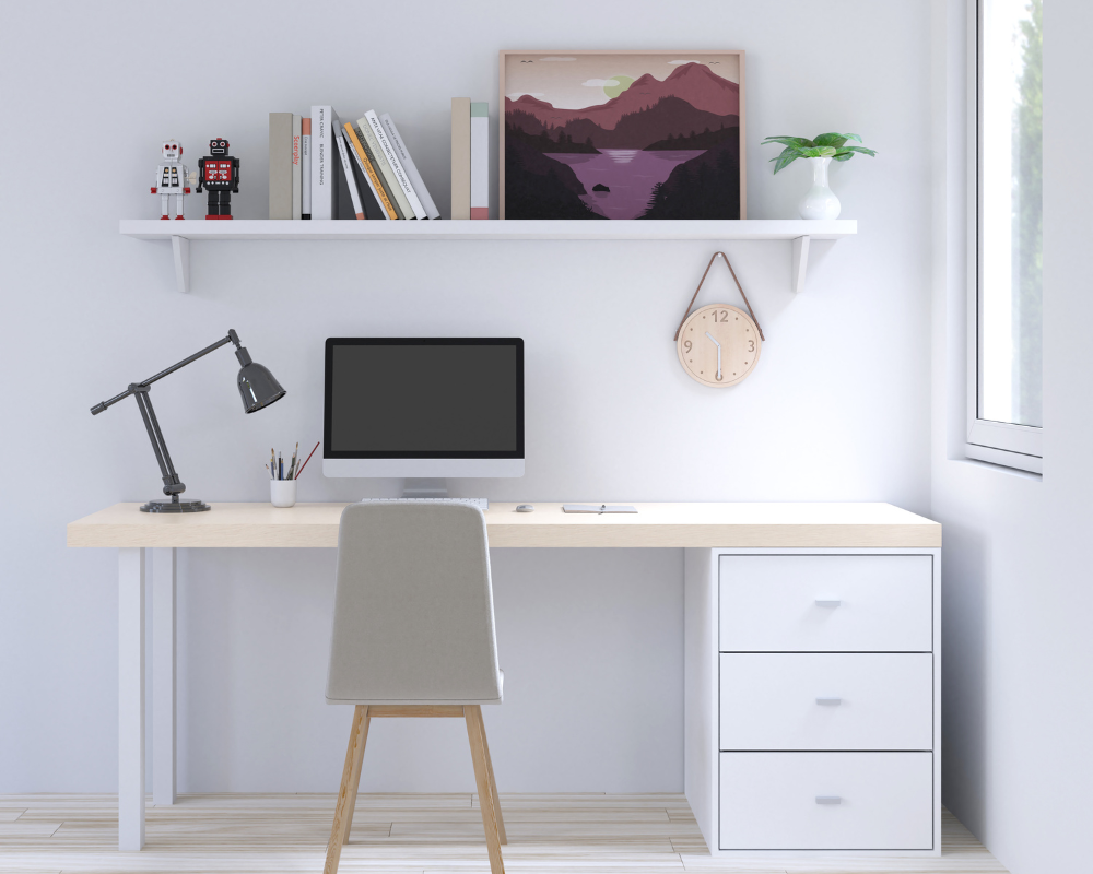 image of a desk against a wall with a shelf above it; demonstrating how to set up a home office for success